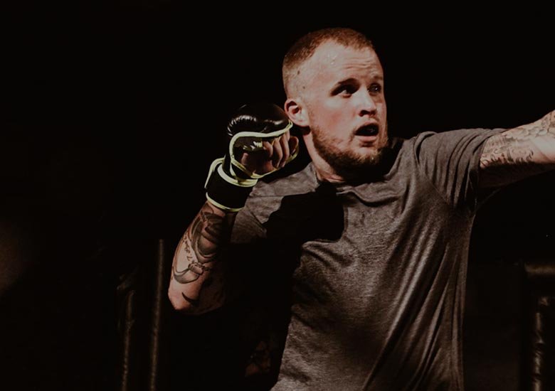 A young man practicing punches