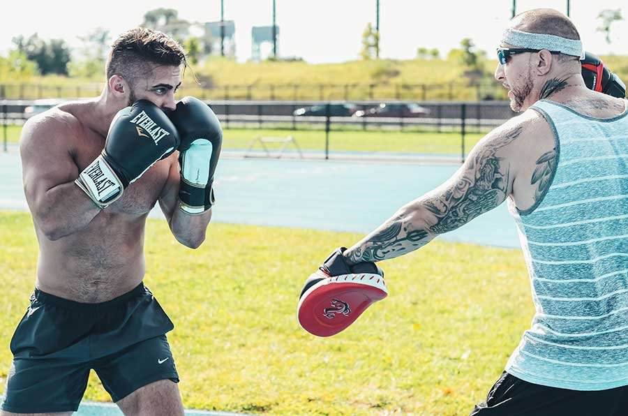 Two men boxing outside