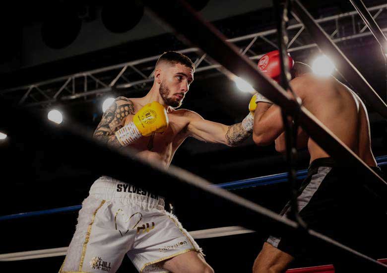 Two men boxing in a ring