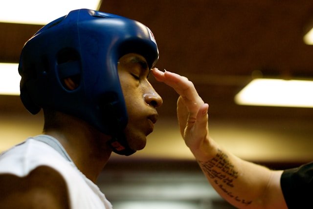 A man wearing a boxing headguard