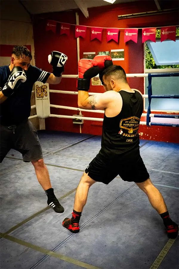 Boxing club member Dan sparring in the ring