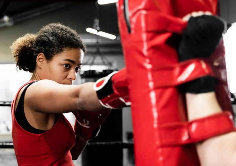 A woman taking part in a women's boxing session